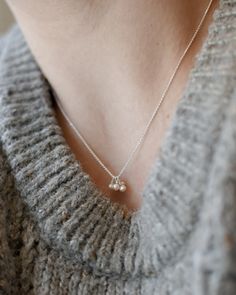 "𝗘𝗮𝘀𝘆 𝗧𝗼 𝗦𝘁𝘆𝗹𝗲, 𝗠𝗮𝗱𝗲 𝗧𝗼 𝗟𝗮𝘀𝘁 Our dainty pearl necklaces are great for layering and ready to be personalized with your most special sentiments, moments, and memories! Created to last a lifetime, these necklaces will remain evergreen even as the years and trends come and go. 𝗠𝗮𝘁𝗲𝗿𝗶𝗮𝗹𝘀 𝗪𝗲 𝗨𝘀𝗲 This necklace features 5 pearls of varying sizes and is made entirely with sturdy 14k yellow gold filled, 14k rose gold filled, or sterling silver pieces. It is safe to wear in the shower, but we recommend avoiding prolonged exposure to chemicals like chlorine to keep your necklace like new! 𝗟𝗲𝗻𝗴𝘁𝗵 𝗢𝗽𝘁𝗶𝗼𝗻𝘀    We have lengths between 14\" - 22\" available! 𝗠𝗼𝗿𝗲 𝗗𝗲𝘁𝗮𝗶𝗹𝘀 -Dainty chain measures 1mm wide -       Pearls measure 2mm-3mm -Spring ring cla Silver Pearl Charm Necklace As Gift, Everyday Silver Charm Necklaces With Pearl Chain, Everyday Silver Charm Necklace With Pearl Chain, Sterling Silver Charm Necklace With Pearl Chain For Gift, Personalized Silver Pearl Necklaces, Pearl Cluster Necklace, Dainty Pearl Necklace, Pearl Necklaces, Pearl Cluster