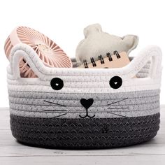 a basket with a cat face on it