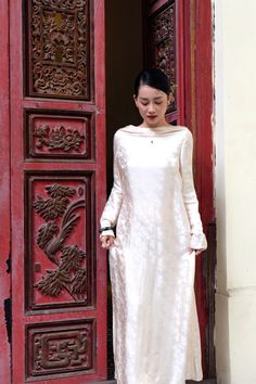 Indulge in luxury with the ao dai. Crafted with the finest silk, this elegant piece boasts a boat neckline and a straight silhouette that effortlessly flows to the floor. Elevate your style and embrace sophistication with this exclusive masterpiece. Length: 130cm (Ao Dai), 114cm (Pants) Elegant Long Ao Dai For Ceremonial Use, Elegant Long Ao Dai For Ceremonial, Elegant Long Ao Dai For Ceremonial Occasions, Ceremonial Long Sleeve Ao Dai, Elegant Long Sleeve Ceremonial Ao Dai, Elegant Long Sleeve Ao Dai For Ceremonial Occasions, Elegant Long Sleeve Ao Dai For Ceremonies, Elegant Silk Ao Dai With Long Sleeves, Elegant Silk Long Sleeve Ao Dai