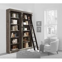 a ladder leaning up against a bookcase in a room with white walls and furniture