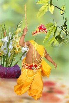 a doll is holding a stick in its hand and some flowers are on the table