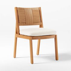 a wooden chair with a white cushion on the seat and backrest, against a white background