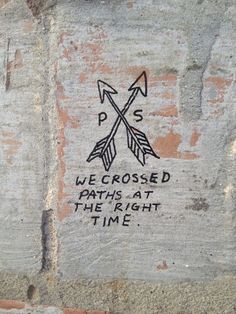 some graffiti on the side of a brick wall that says, we crossed paths at the right time