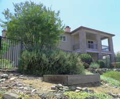 a large house sitting on the side of a hill