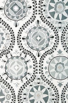 an image of a black and white wallpaper with circular designs on the back ground