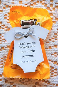 a baby's diaper with a note attached to it