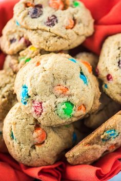 a basket full of cookies with candy on top