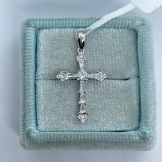 This beautiful diamond cross is set with baguette and round cut diamonds. The diamonds are white and sparkling. Lays nicely on the neck, won't flip around. Very different with the different cuts of diamonds, very pretty design. This cross is not too big or small and has a nice sparkle to it. Cross measures from top of bail 26 x 14mm. Genuine Diamonds baguette and round cuts total weight: 0.32 carats Clarity: VS/SI Color: F 18K White gold setting Comes with gift box * We have been in the wholesal Baguette Diamond Cross Pendant Jewelry For Gifts, Diamond Cross Necklace For Wedding, Elegant Cross Shaped Jewelry With Baguette Diamonds, Elegant Cross Jewelry With Baguette Diamonds, Anniversary Diamond Crucifix Necklace, Diamond Crucifix Necklace For Anniversary, Anniversary Diamond Necklace With Crucifix, Cuts Of Diamonds, Morganite Wedding Rings