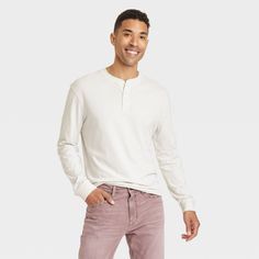 This Long-Sleeve Henley Shirt from Goodfellow & Co in a solid color makes a versatile and cozy wardrobe pick. Fashioned in a regular fit, it features a three-button placket henley neckline for a touch of classic style. The 100% cotton material keeps you in all-day comfort, while the pullover design makes for easy wear. Pair this top with a range of different bottoms, or layer under jackets or cardigans for additional warmth. Goodfellow & Co™: Where style & fit are always in good company. Classic Long Sleeve Henley For Spring, White Long Sleeve Tops For Casual Gatherings, Casual Long Sleeve Winter Henley, Casual Long Sleeve Henley For Winter, White Cotton Henley For Fall, Casual Relaxed Fit Henley For Spring, White Henley For Fall, Cotton Henley For Fall, Solid Cotton Henley For Fall