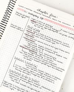 an open notebook with writing on it