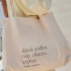 a tote bag that says drink coffee, buy plants, repeat water and design co