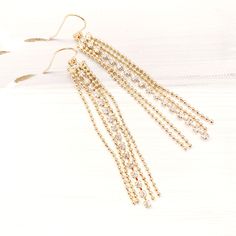 Gold Tassel earrings, Cubic Tassel earrings, Long Chain Tassel earrings, Chain gold earrings Elegant Tassel Earrings For Festive Occasions, Elegant Gold Tassel Earrings As Gift, Elegant Gold Tassel Earrings For Gift, Elegant Gold Tassel Earrings With Ear Wire, Gold Tassel Jewelry For Celebration, Gold Jewelry With Tassels For Celebrations, Crystal Dangle Earrings With Charms For Party, Glamorous Gold Dangle Tassel Earrings, Glamorous Dangle Chandelier Earrings As Gift