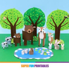 paper cut out of animals and trees on the ground with text that reads super fun printables