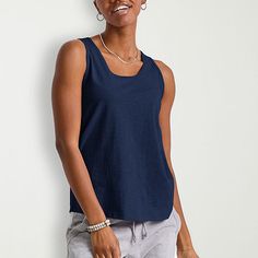 Basics that are far from basic. This cute and comfortable women's tank will get you from here to there in style with ease. Made with recycled polyester, so it's lightweight and has that soft-to-the-touch feel you know and love. A roomy fit that can be dressed up or down. Quality-wise, this tank does the most! Banded collar, armholes, and double-needle stitching on the hem for a fit that won't quit. Grab a few in our basic colors and beef up your staples with these tank tops for women by Hanes or Blue Relaxed Fit Tank Top, Everyday Blue Sleeveless Tank Top, Blue Relaxed Fit Tank Top For Everyday, Casual Blue Sleeveless Tank Top, Blue Sporty Tank Top For Everyday Wear, Versatile Relaxed Fit Tank Top, Band Collar, U Neck, Sleeveless Tank Top