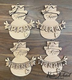 wooden snowman ornament with name on it and two other ornaments in the shape of snowmen