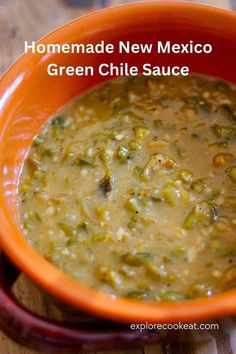 homemade new mexico green chile sauce in an orange bowl on a wooden table with text overlay