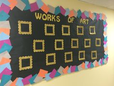 a bulletin board that says works of art on the wall in front of a classroom