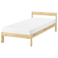 the bed frame is made from wood and has white sheets on it, with no mattress