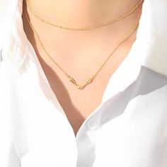 This V pendant necklace is made of silver, The delicate and cute V shape is every girl's dream pendant style, we design it, so it will be an unusual gift. Detail Item No: JC-Necklace-12Material: S925 silverColor: goldSize: pendant 24.5*12mm/chain width 1.2mmChain length: 44cm/47cm (two adjustable sizes)Weight: 2.56-2.66g Elegant Pendant Necklace With Double Chain, Elegant Double Chain Pendant Necklace, Elegant Sterling Silver Layered Necklace With Clavicle Chain, Elegant Round Pendant Charm Necklace With Double Chain, Elegant Double Chain Charm Necklace With Round Pendant, Gold Y-shape Clavicle Chain Necklace, Dainty Double Chain Necklaces For Formal Occasions, Dainty Double Chain Necklace For Formal Events, Dainty Double Chain Necklace For Formal Occasions