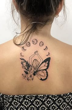 a woman with a butterfly tattoo on her back