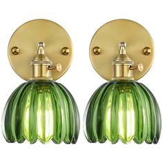 pair of green glass wall lights with gold metal fittings