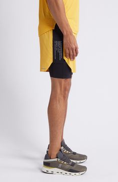 Train hard in layered performance shorts constructed with a lightweight overlay, convenient drop-in pockets and stretchy shorts underneath. 9" inseam; 15" leg opening; 12 1/2" front rise; 13 1/2" back rise (size medium) Elastic waist Side drop-in pockets Partially lined 84% nylon, 16% elastane Machine wash, tumble dry Imported Outdoor Compressive 2-in-1 Bottoms, Compressive Outdoor Shorts, Compressive Short Bottoms For Outdoor, Technical Bottoms With Built-in Shorts For Running, Functional Nylon Shorts With 4-way Stretch, Compressive Athletic Shorts With Built-in Shorts For Outdoor, Compressive Shorts With Built-in Shorts For Outdoor, Nylon Athletic Shorts With Functional Pockets, Running Bottoms With Built-in Shorts And Athletic Fit