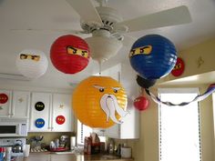 some paper lanterns hanging from the ceiling in a kitchen with angry birds on them and other decorations