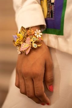 Metallic gold toned bracelet with multi colored garden, floral, bird, butterfly carved 3D motifs. - Aza Fashions Whimsical Multicolor Bracelet Jewelry, Whimsical Multicolor Wedding Jewelry, Jewellery Bracelets, Bracelets Gold, Enchanted Garden, Buy Gold, Brass Color, Aza Fashion, Metallic Gold