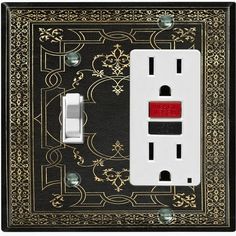 a black and gold wall plate with a red light switch