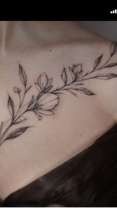 a woman's chest with leaves on it