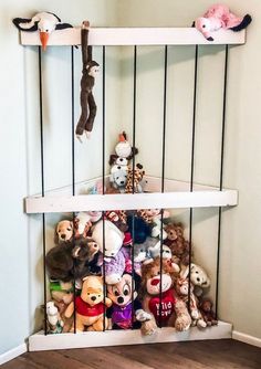 two shelves filled with stuffed animals on top of each other