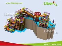 an indoor play area with slides and climbing walls