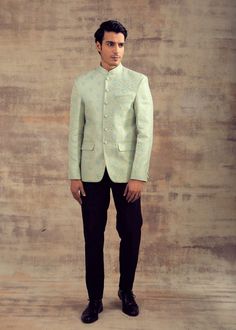 This Jodhpuri Jacket is in Banarasi Silk with Gold zari and Resham weaving. It can also be paired with any pastel colour Kurta Set or any pastel colour Slim Pants. Brand: Panache Haute Couture Availability: Online and In-store Delivery Time: 4-6 Weeks Fabric: Jacket - Banarasi Silk Customisation: Limited Colour Options Available. For more colour options in the fabric please contact our team through WhatsApp+61470219564 Disclaimer: The model is of Size 40 and is 5 feet 10 inches tall and the mode Formal Pista Green Sets With Chikankari Embroidery, Spring Reception Bandhgala With Long Sleeves, Spring Reception Bandhgala, Spring Reception Long Sleeve Kurta, Spring Reception Long Sleeve Bandhgala, Spring Reception Bandhgala With Zari Work, Semi-formal Long Sleeve Nehru Jacket For Spring, Traditional Nehru Jacket For Reception In Spring, Embroidered Nehru Jacket For Diwali Semi-formal Occasions