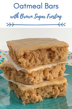 two pieces of cake sitting on top of a blue plate with white frosting and the words, oatmeal bars with brown sugar frosting