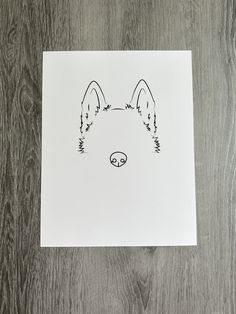 a drawing of a dog's face on a piece of paper