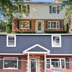 before and after shots of a house with blue siding, white windows, and red brick