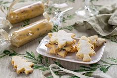 some food is sitting on a plate and next to other items that are wrapped in plastic