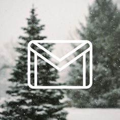 an email envelope in the snow with trees behind it