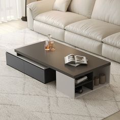 a coffee table sitting on top of a white carpeted floor next to a couch