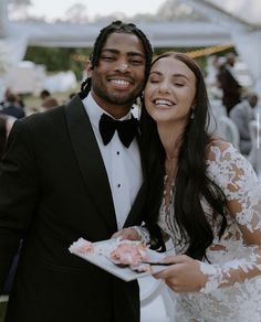 a man and woman standing next to each other