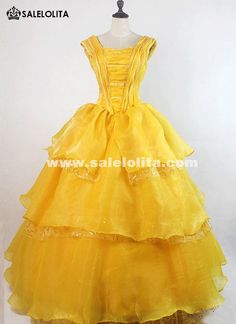 a yellow dress on a mannequin stand