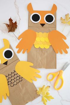 paper bag owl craft with scissors and leaves