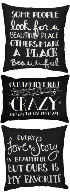 three black and white pillows with different words written on the front, back and sides