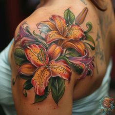 a woman's shoulder with flowers on it