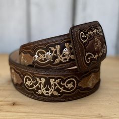 The price already INCLUDES sales tax and shipping within the United States!
 Immerse yourself in the spirit of the West with our embroidered western belt, featuring genuine cow hair, and made entirely in Mexico. In a warm brown shade and made from 100% genuine leather, this belt features 5 rows of adjustable holes to ensure the perfect fit. Its 2" width and single-pin buckle combine style and functionality. An artisanal piece, with details handmade with passion in Mexico, to highlight your authe Vaquera Outfit Mexican, Western Belts For Women, Mexican Clothing, Brown Cafe, Mexican Outfit, Cowboy Belt, Embroidered Belt, Belt For Men, Brown Shade