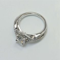 a white gold engagement ring with diamond accents