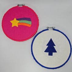 two embroidered hoop art pieces with trees on them