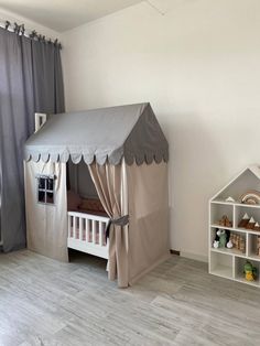 a child's bedroom with a tent and toys