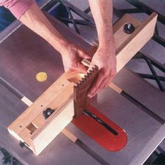 a man is working on a piece of wood with a planer and vise