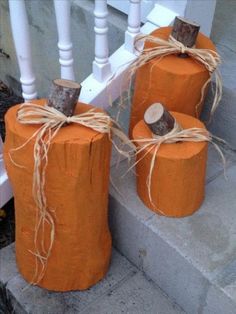 three pumpkins wrapped in twine on the steps